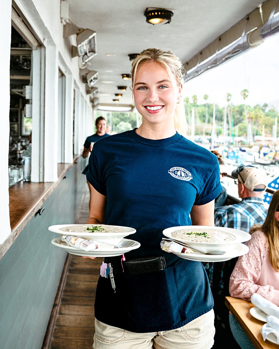 Guests enjoying patio dining near the harbor in Santa Barbara