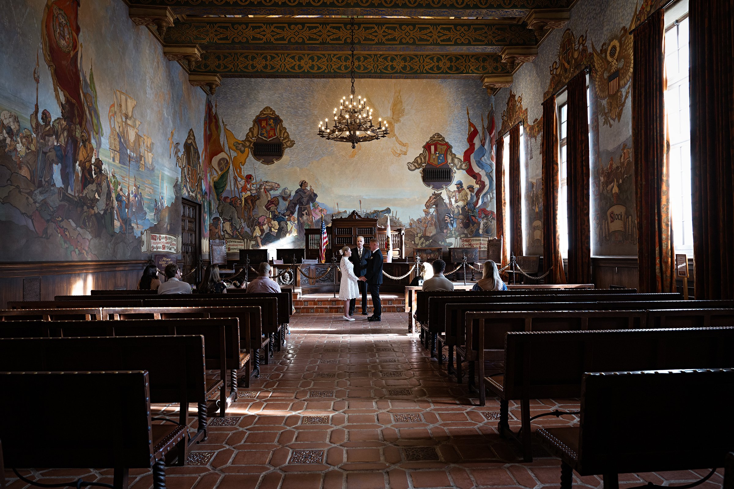 Beautiful natural light floods the wedding ceremony