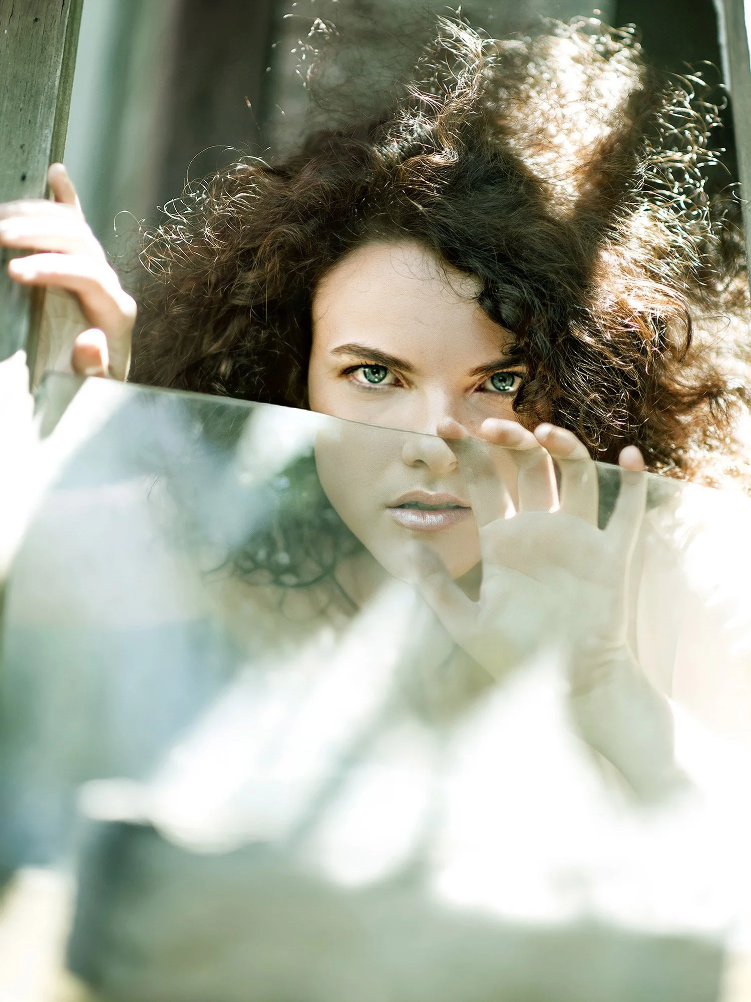 Creative portrait of female model with artistic lighting and location