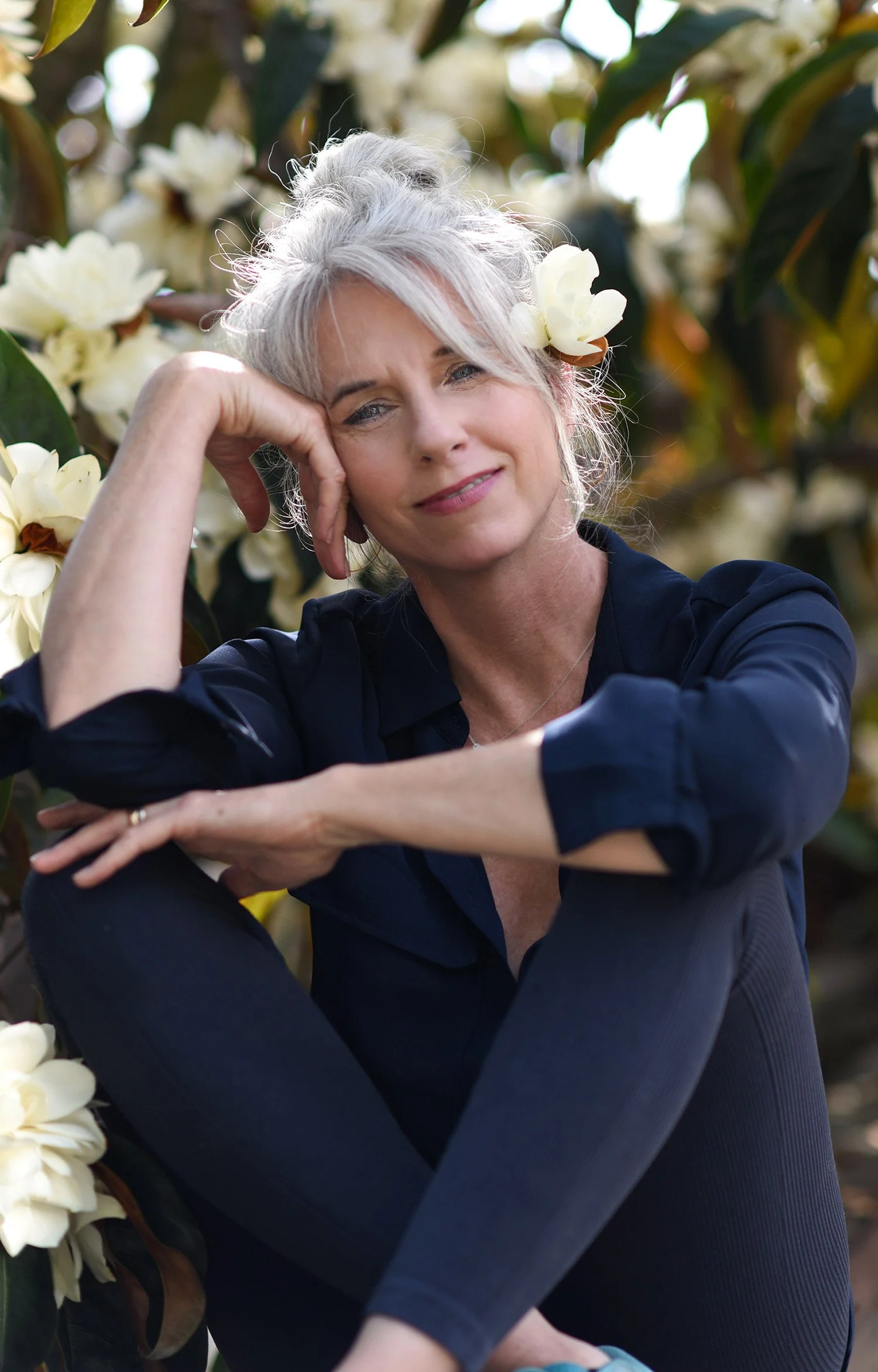 Lifestyle portrait of female professional in natural setting.