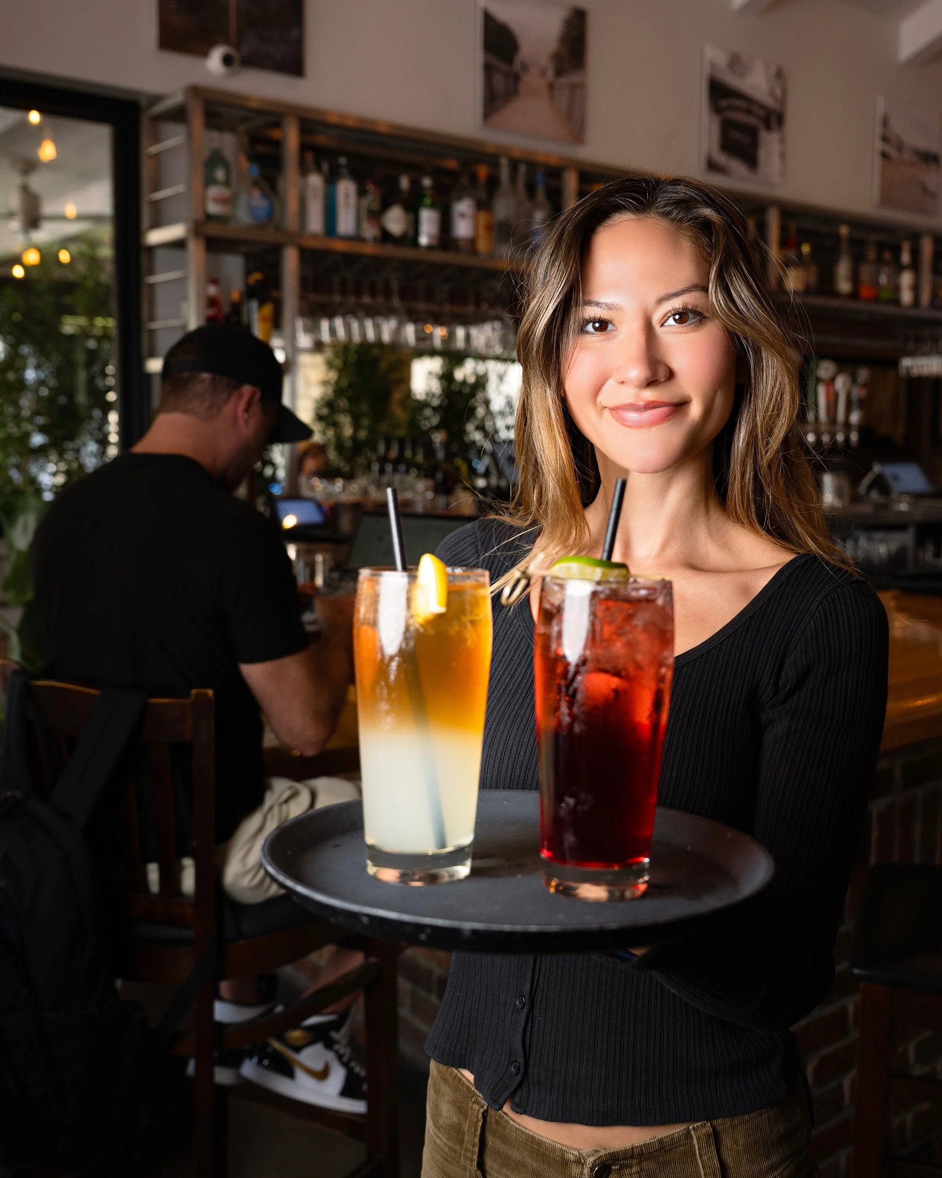 Friendly staff serving cocktails at Benchmark Eatery in Santa Barbara