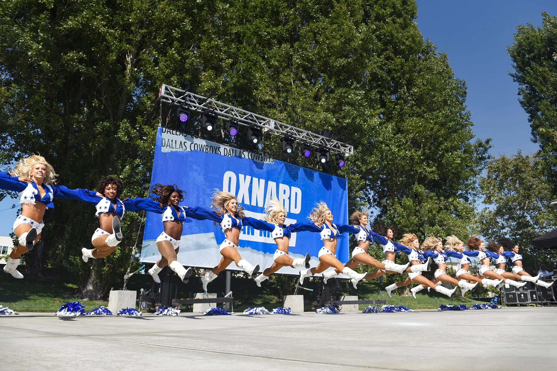 Leaping in unison, the Dalllas Cowboy Cheerleaders put on a show