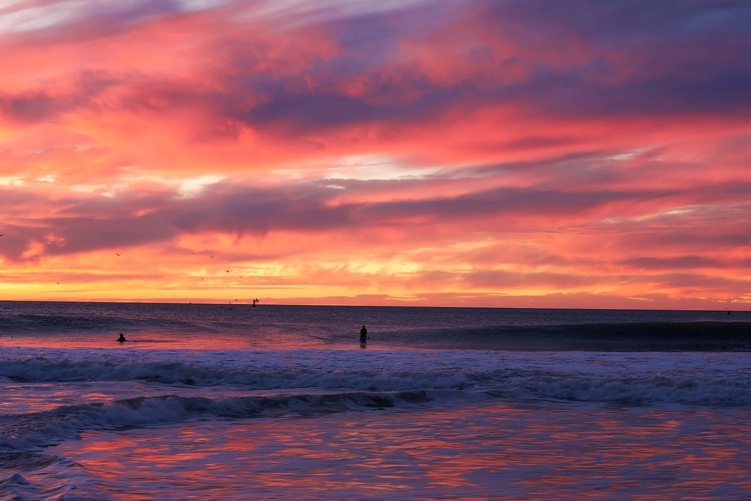 Photos of the ocean sunset with golden light reflecting on the waves in Ventura California