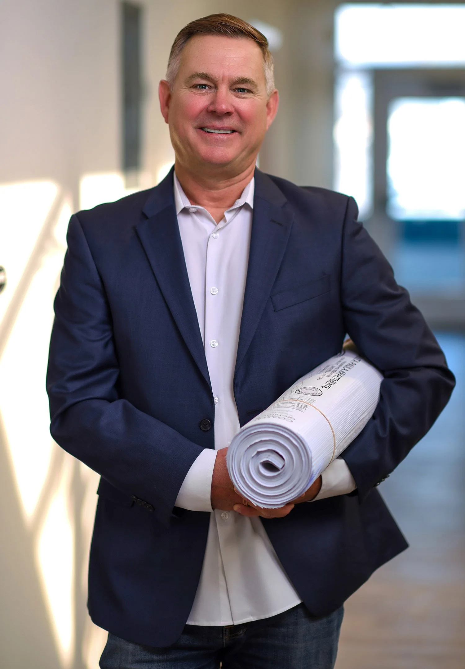 Professional male entrepreneur headshot in natural light