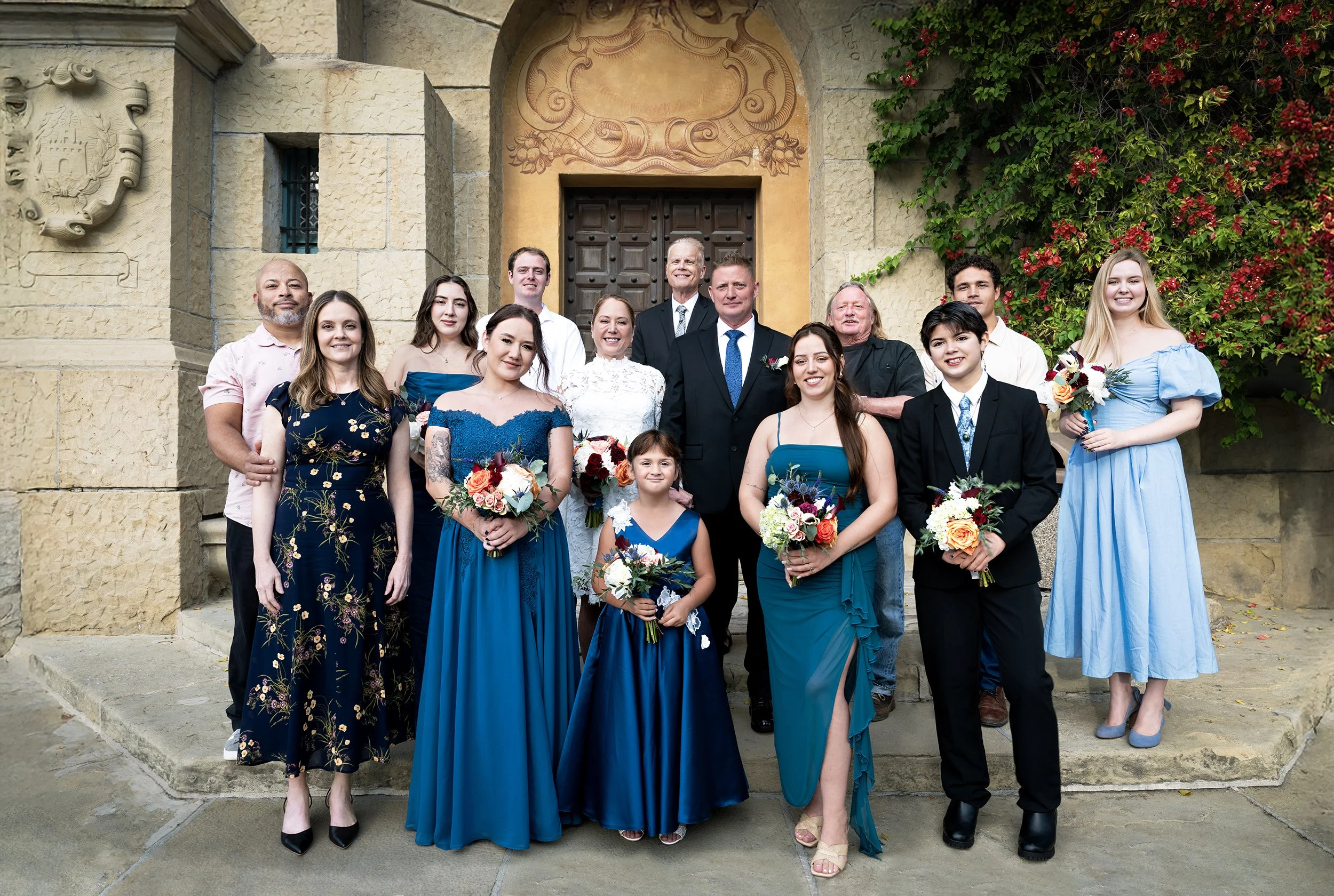 Using natural lighting for wedding party group shot at court house