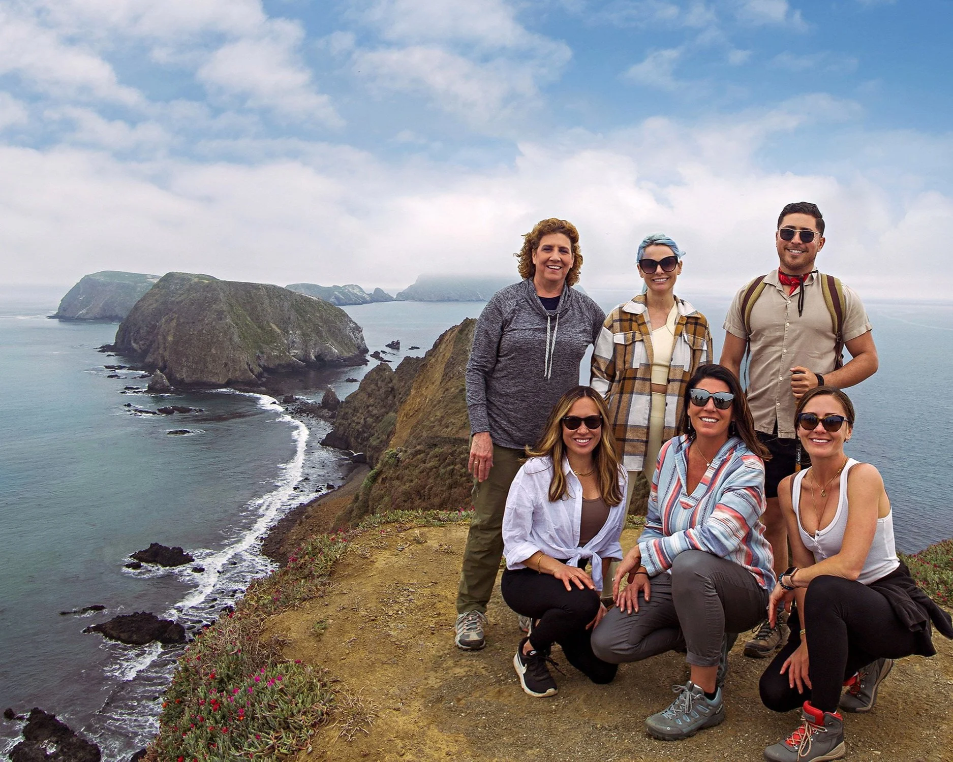 Natural light team portrait for Visitors Group outdoors.