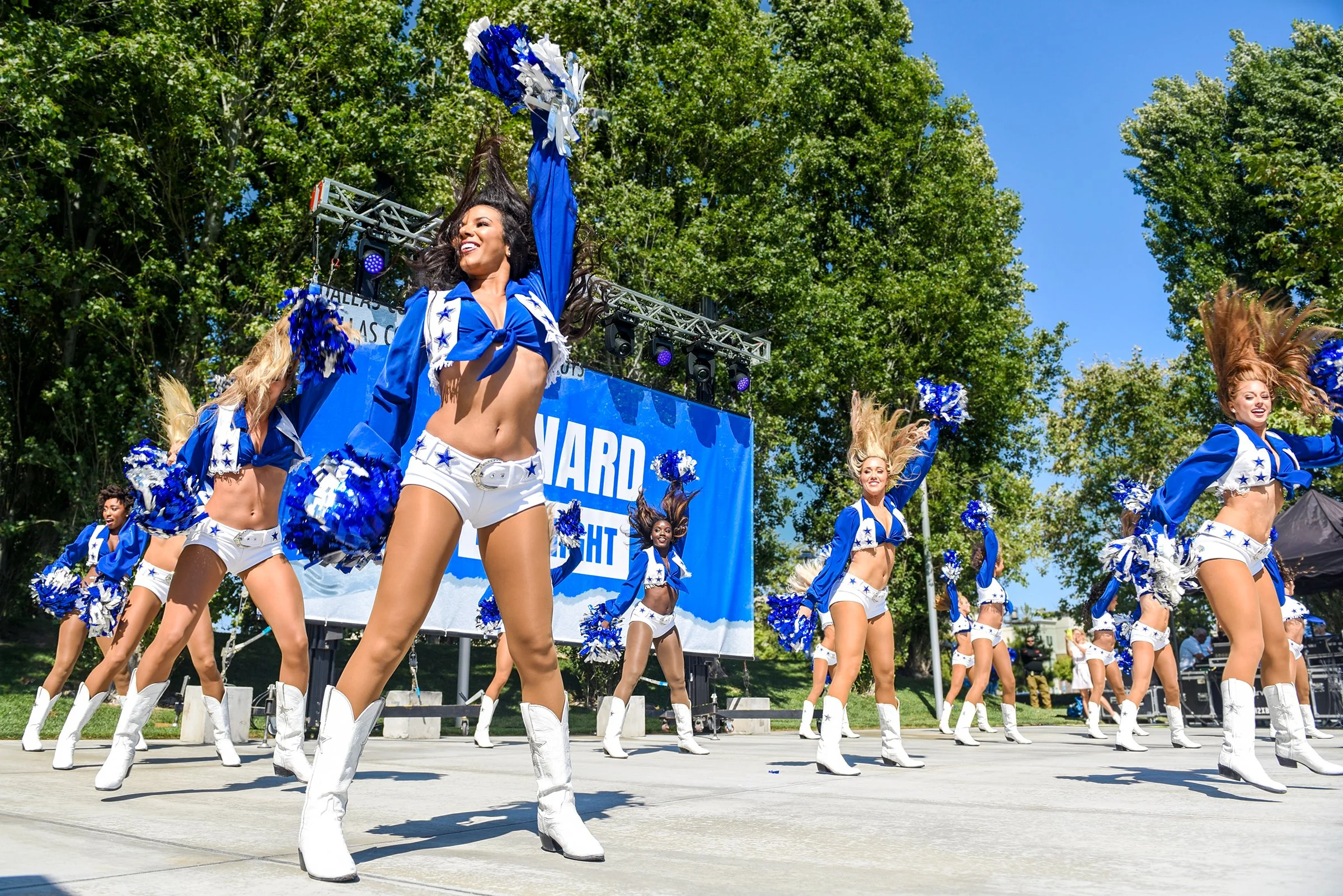 Dallas Cowboy Cheerleaders performing on stage in Oxnard
