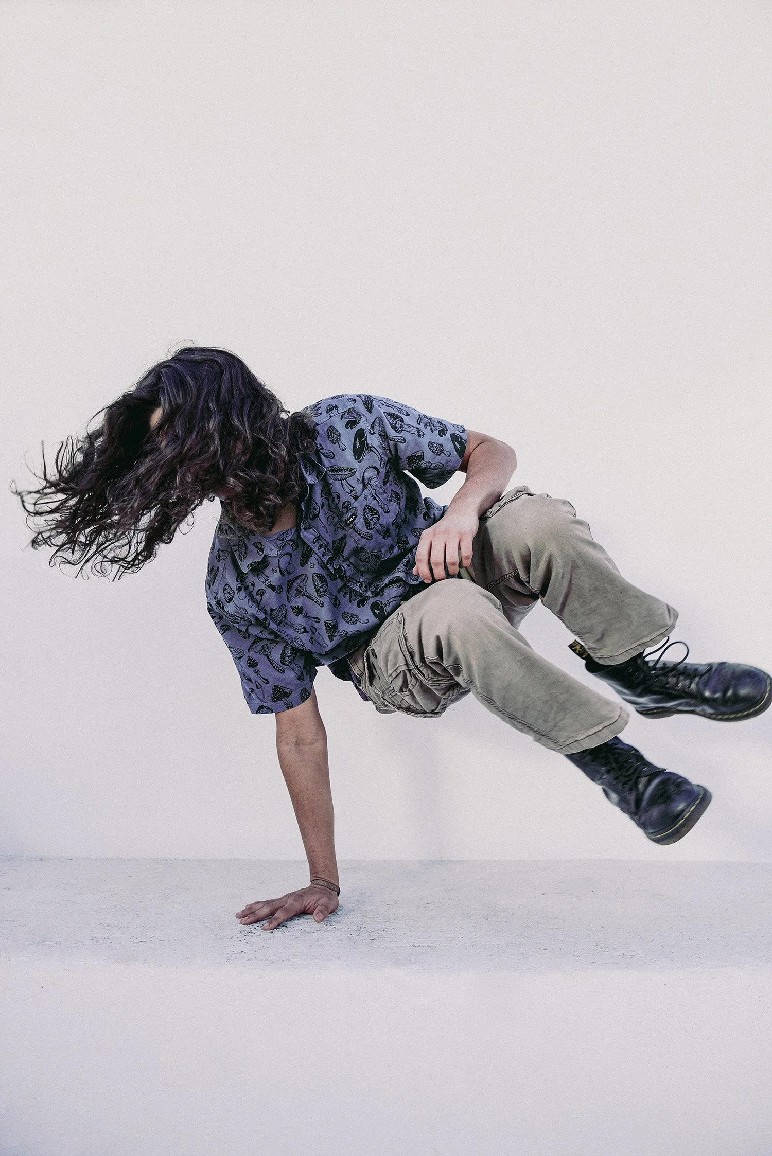 young man doing dance tricks for a fashion shoot