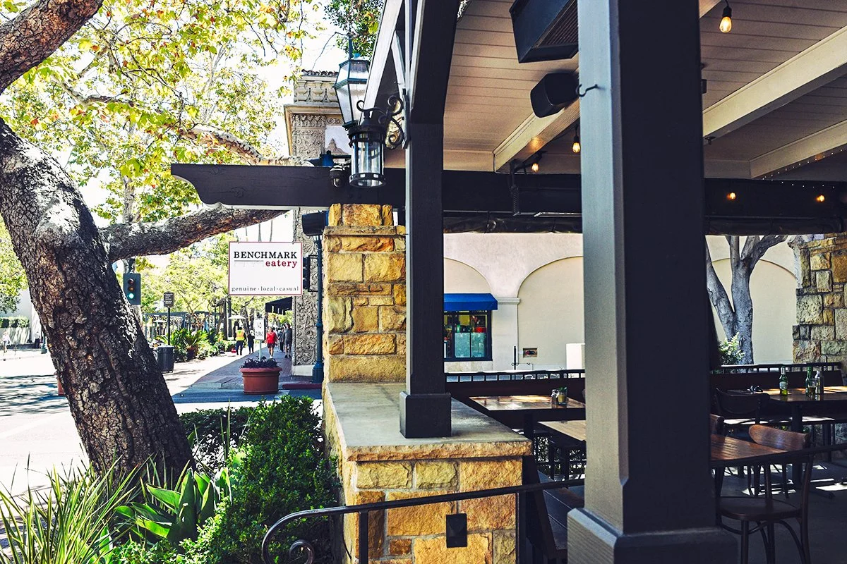 Patio dining with views of downtown State Street at Benchmark Eatery