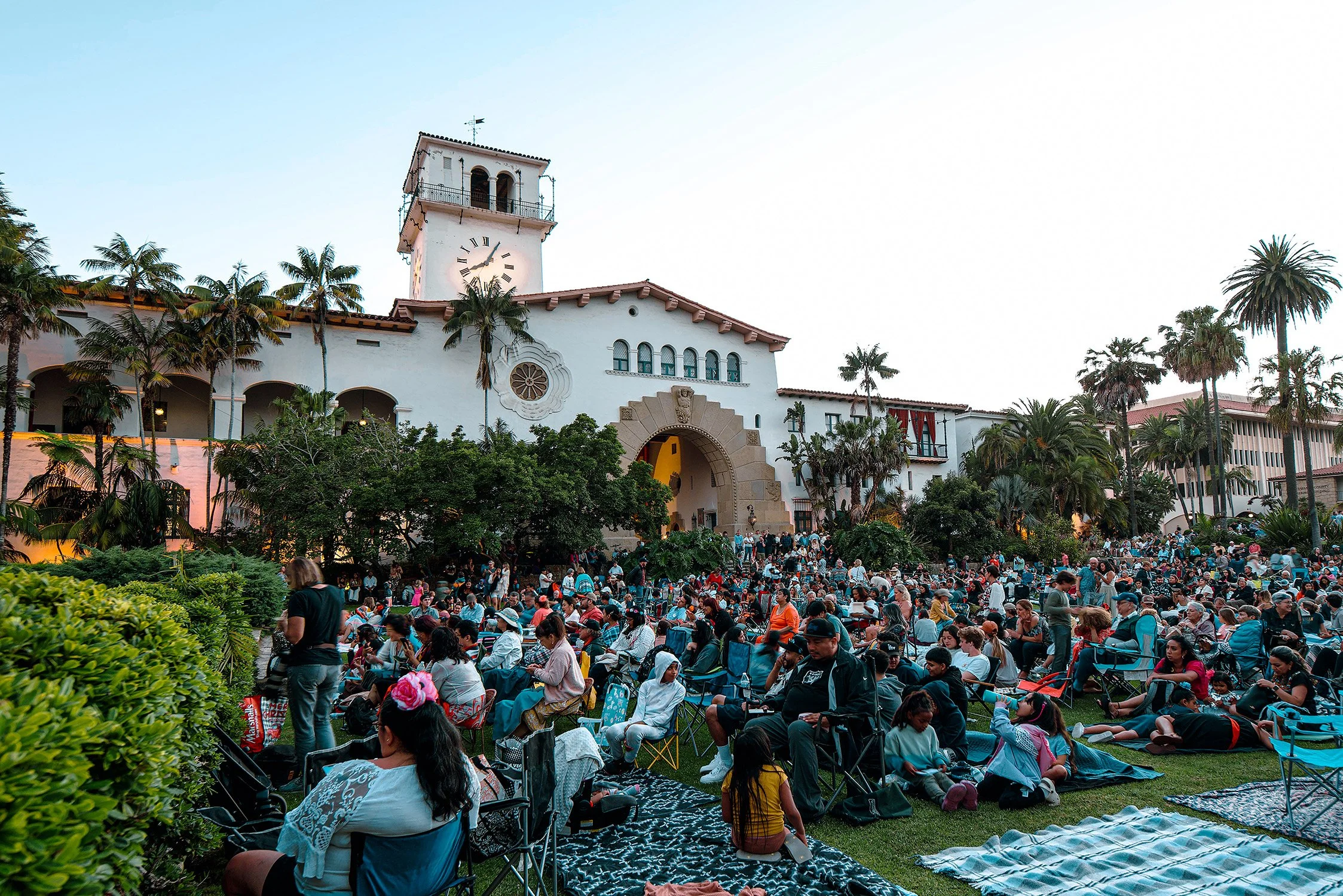 a massive crowd gathers at the Santa Barbara Court house gardens for a performance