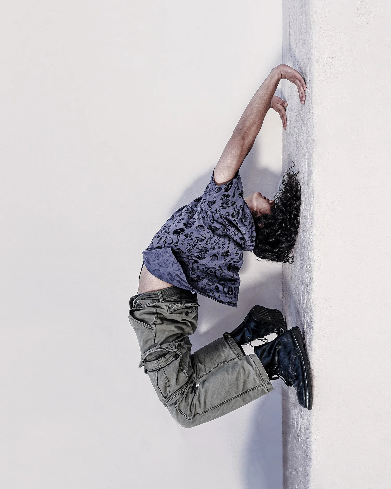 young man doing gymnastics for fashion campaign