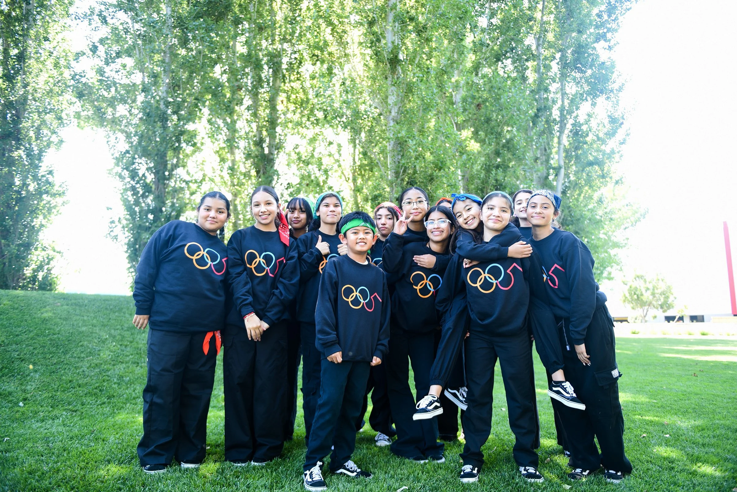 Professional portrait of dance troupe outdoors.