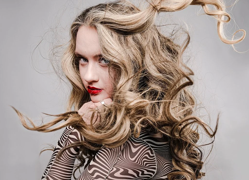 Female model headshot with neutral background