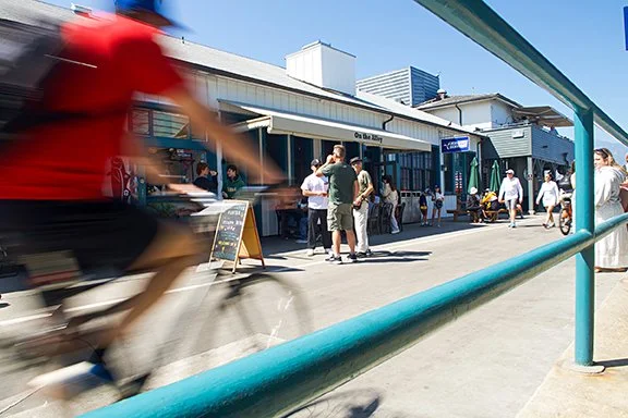 Bicyclist captured in motion with a slow shutter speed.