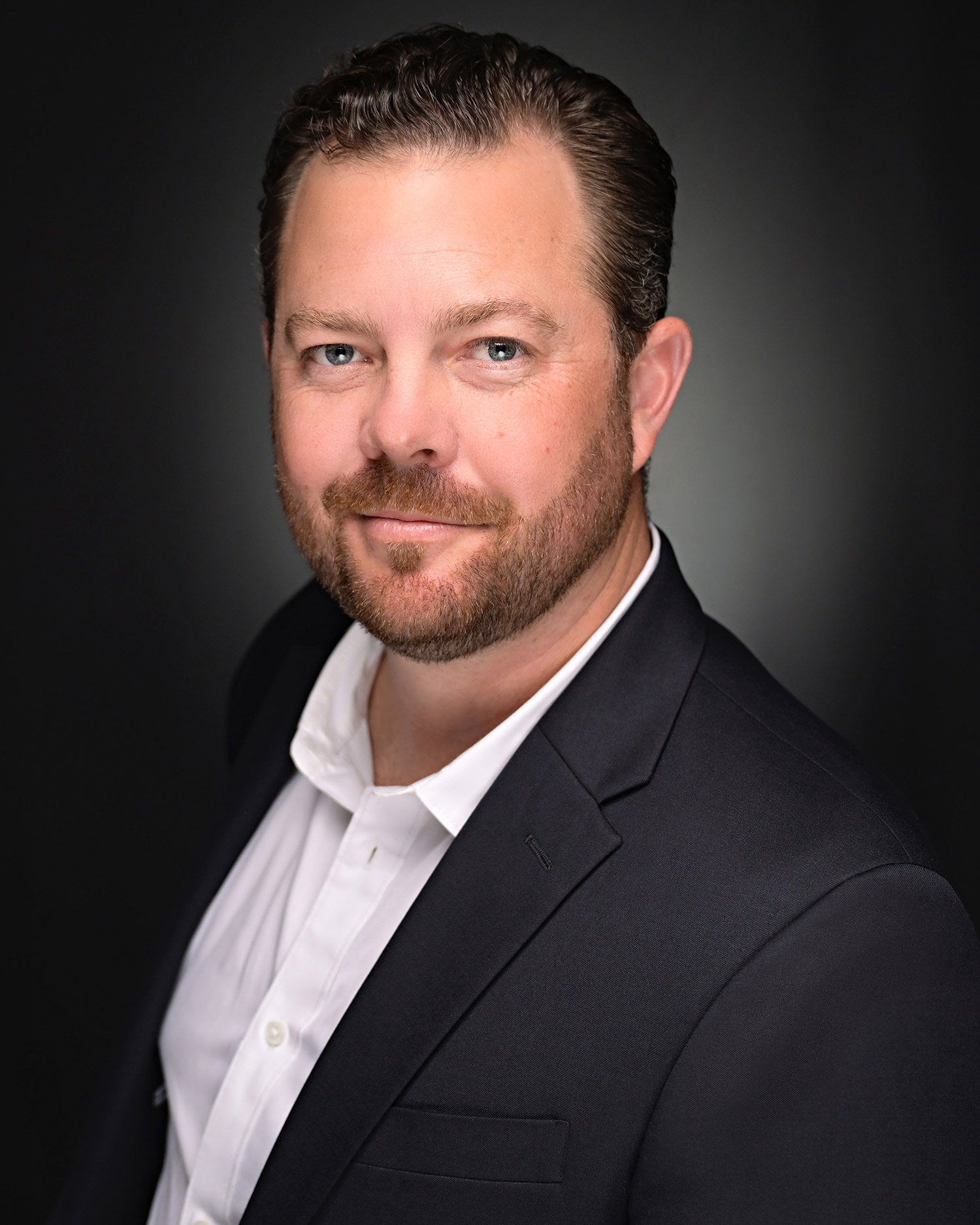 Polished corporate portrait for CEO in Ventura studio.