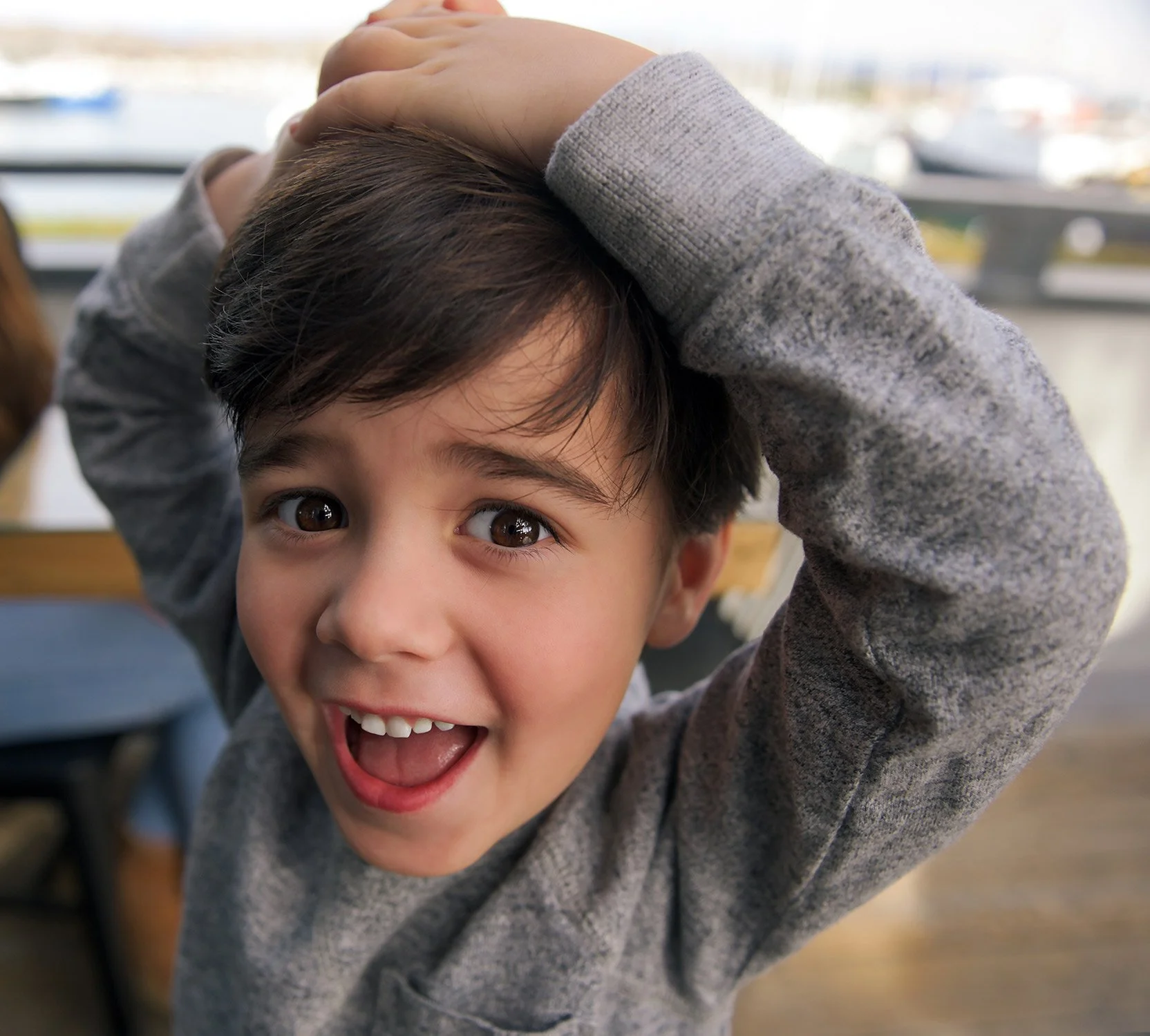 a young boy celebrates at a birthday party