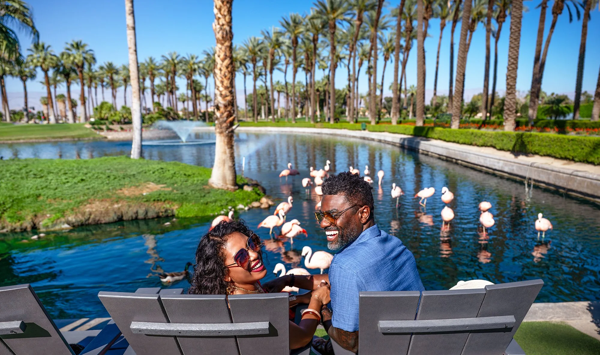 Couple taking in the view at the Flamingo pond at JW Marriott  Palm Desert