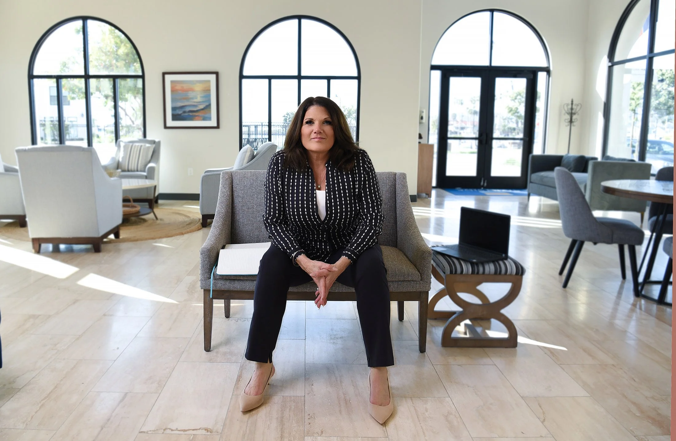 Professional female entrepreneur headshot with natural light.