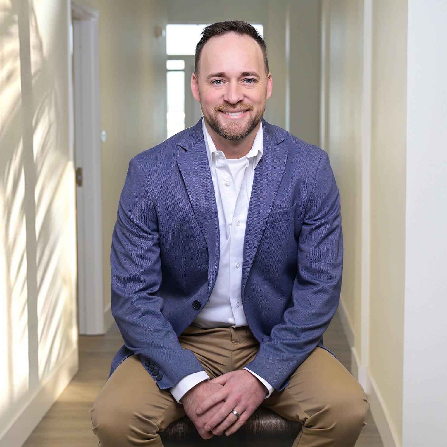 Polished male portrait in office suites in Ventura.