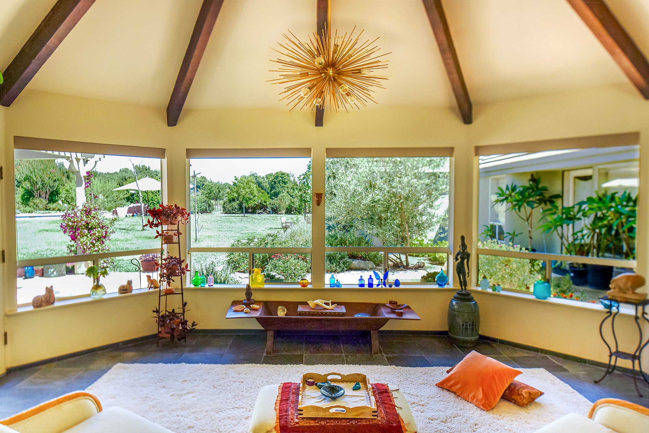 gorgeous bay side windows face a lush garden in Ojai property
