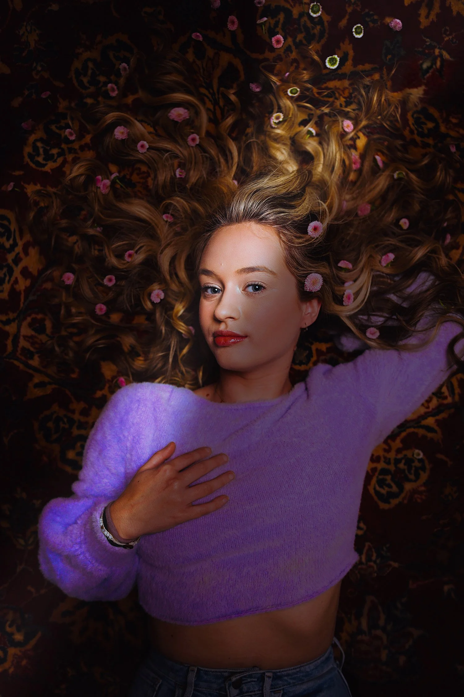 Creative headshot of fashion model with dramatic lighting