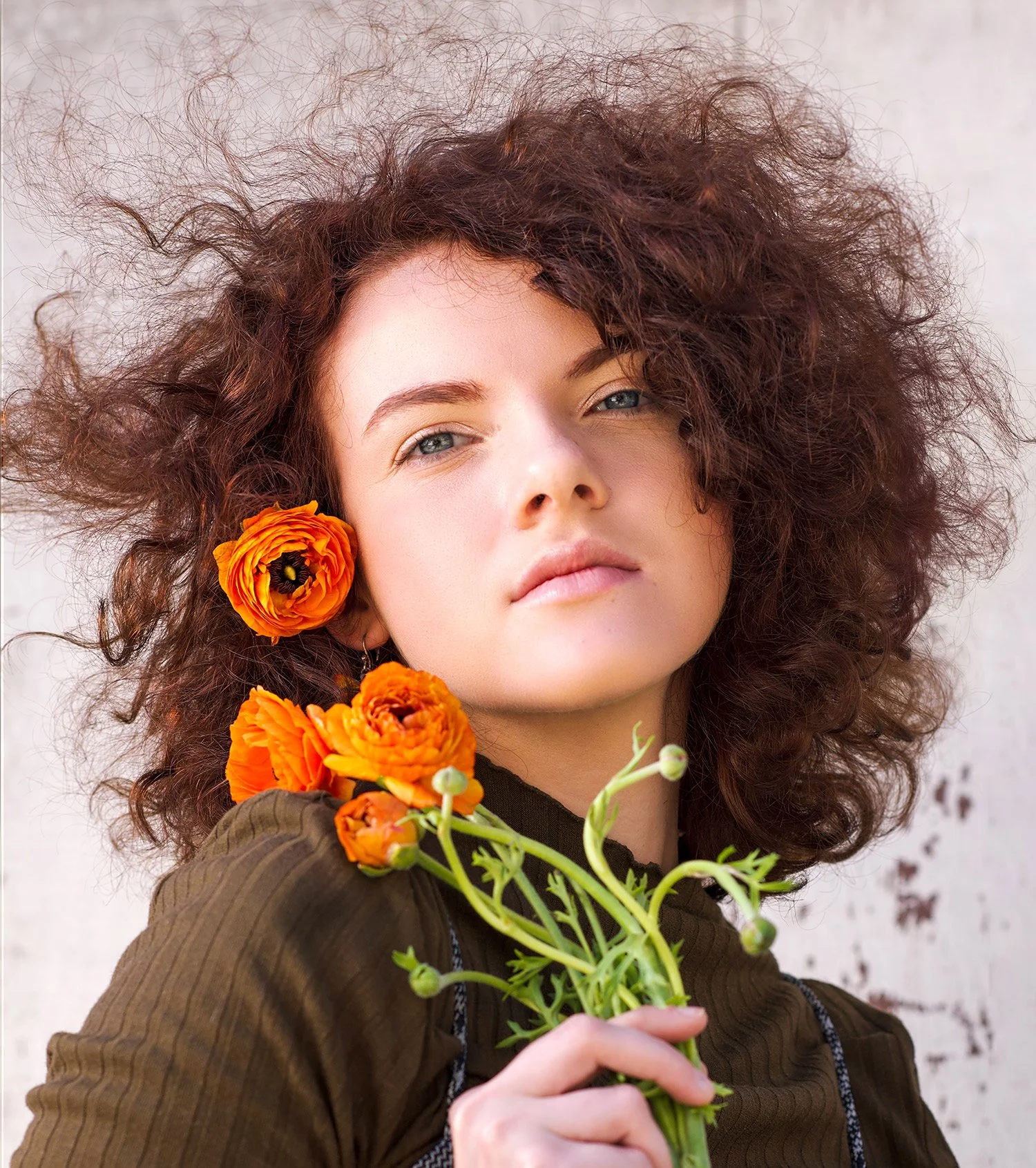 Female modeling headshot with natural light and flowers