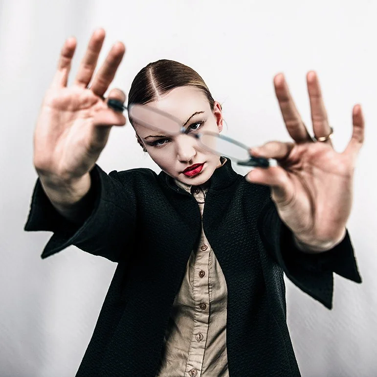 stylish eye wear ad with female with slicked back hair