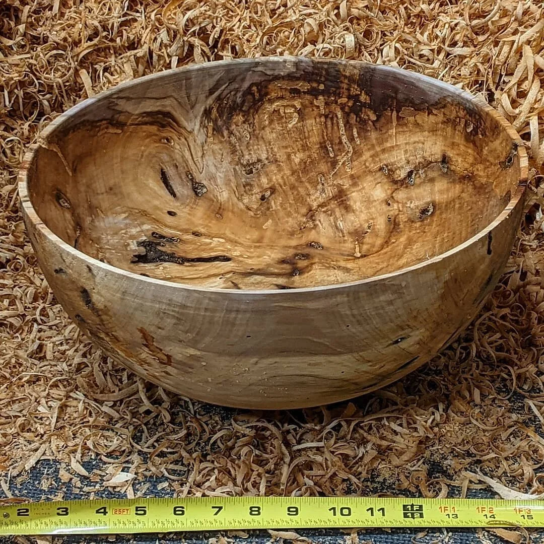 I'm extremely proud of this bowl. It is the biggest one I've turned thus far at 14.5 inches by 7 inches deep. The madrona wood came from the downed tree in my yard (see other post for before), and took 6.5 hours from start to finish. The finished thi