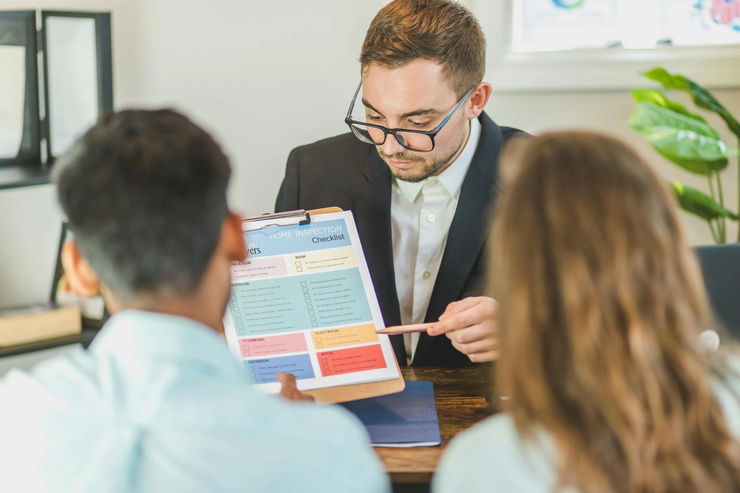 A team member in sales talks to a couple.