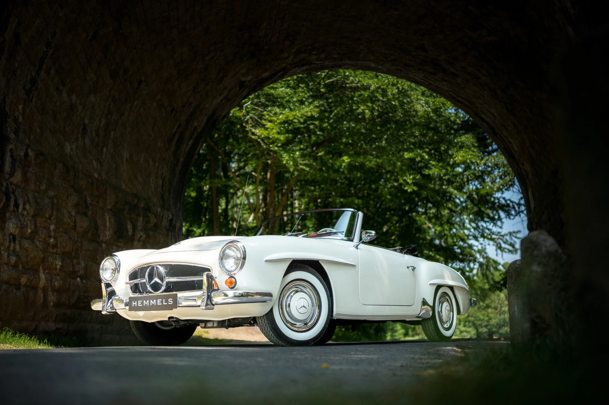 A magnificent 190SL, LHD, and destined for Spain. Cream white with red interior - gorgeous.