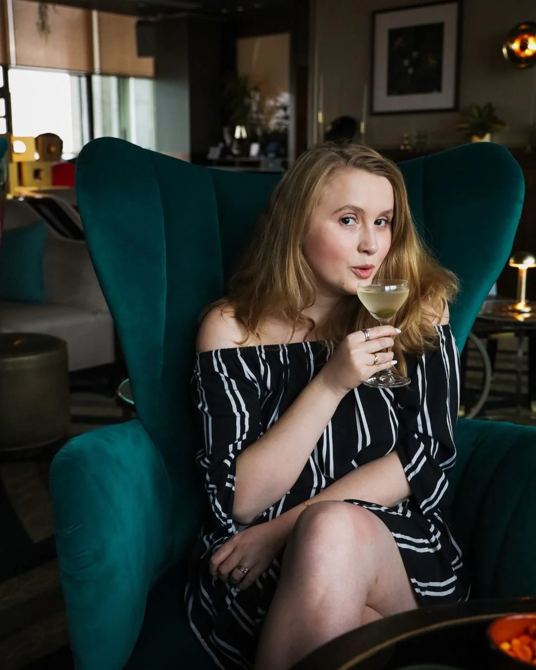 Ailis Brennan-Zielinski holding a martini