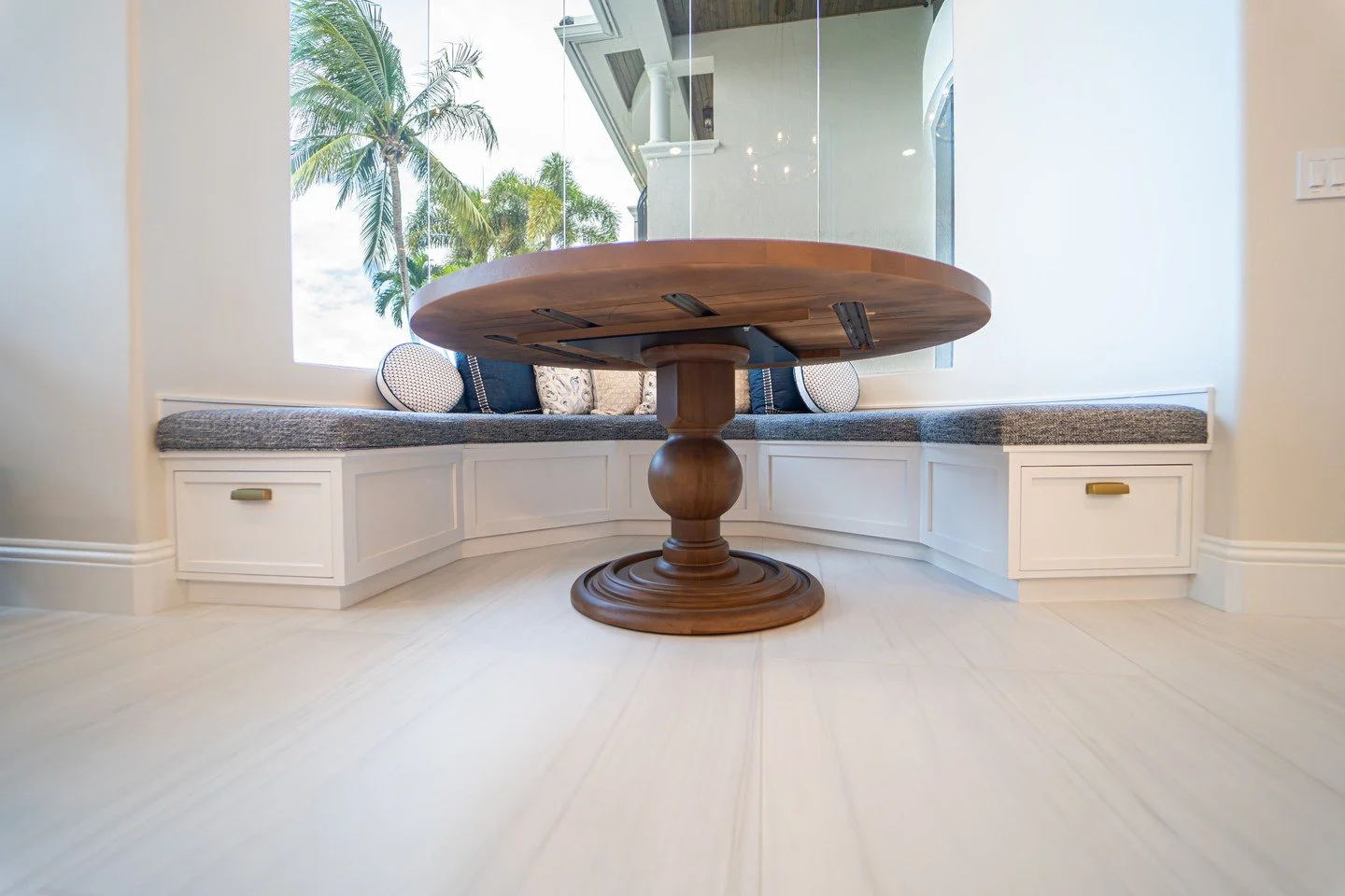 Paired with plush cushions, accent pillows and functional drawers, this semicircle bench seat  becomes the perfect place to relax, gather, and enjoy the view. #installedandloved🖤