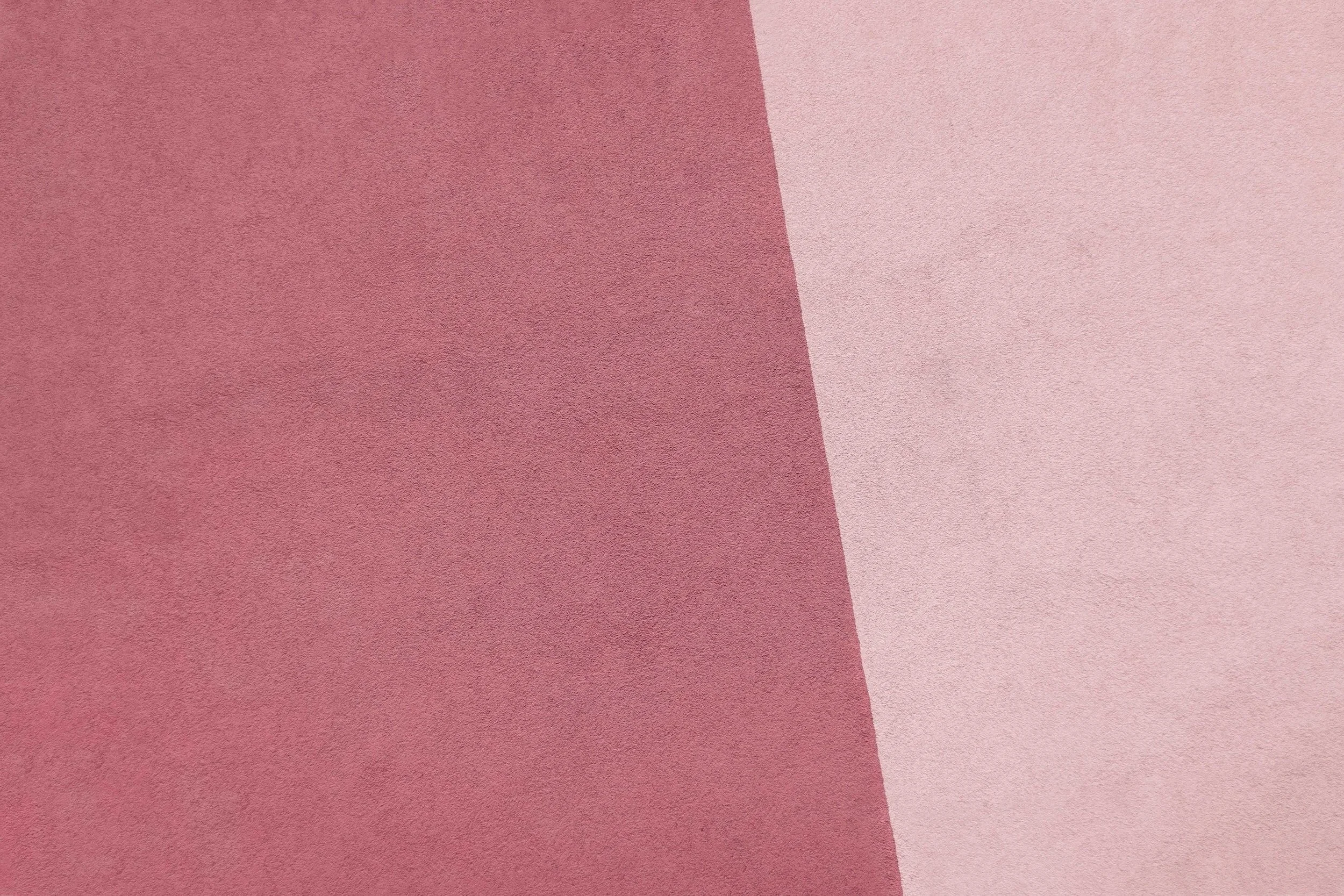 Abstract image with two shades of pink creating a geometric pattern