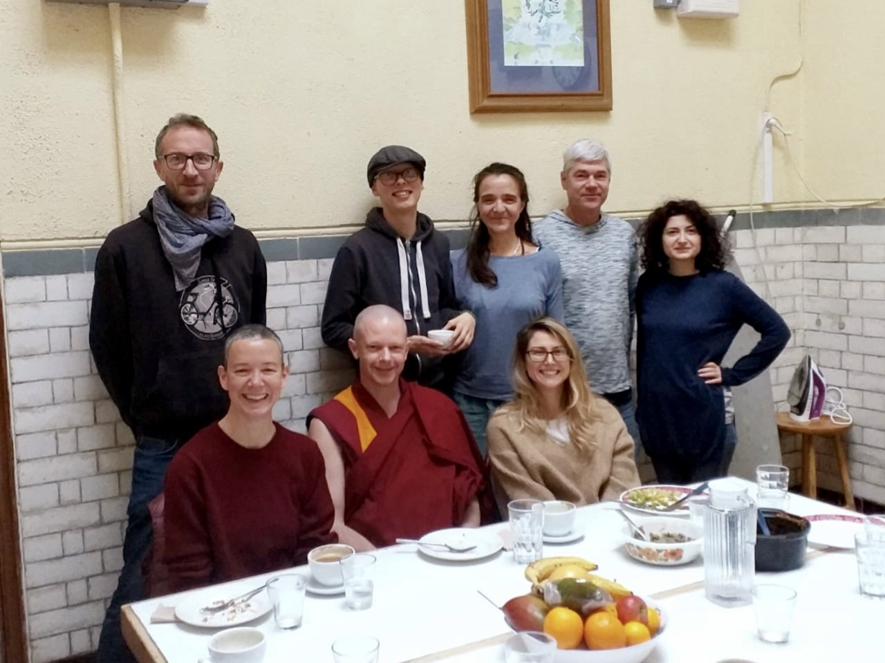 picture of meditation coach, rebecca michelle with a couple of Buddhists monks having lunch