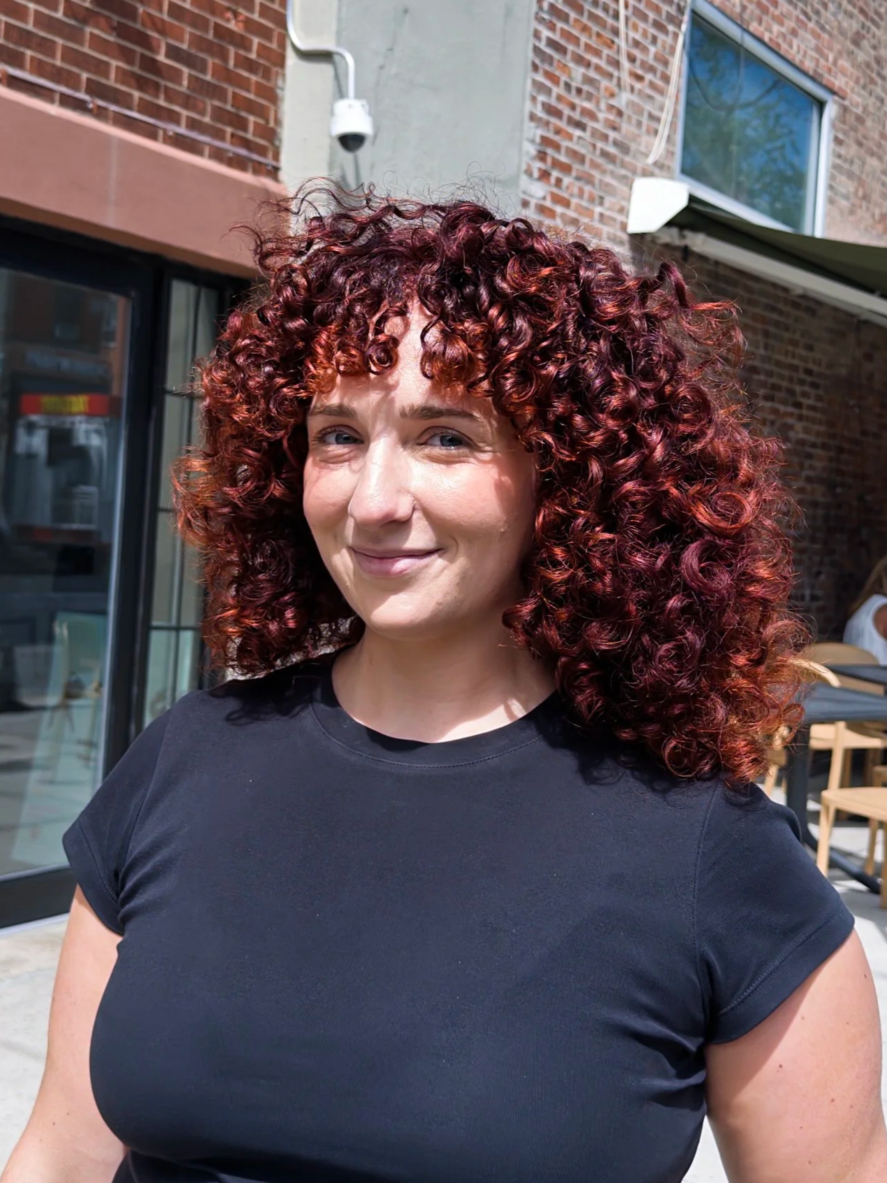 Red curly cut, red shag haircut for curly hair, haircut & style at CutLoose salon. Greenpoint, Brooklyn. Cherry cola hair, cowboy copper hair
