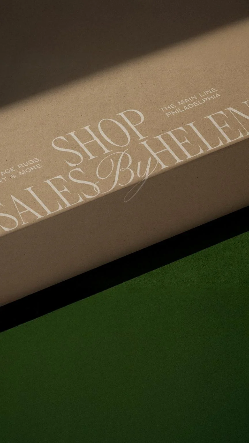 Brown mailerbox with "sales by helen" logo printed on it sitting on a green velvet background.jpg