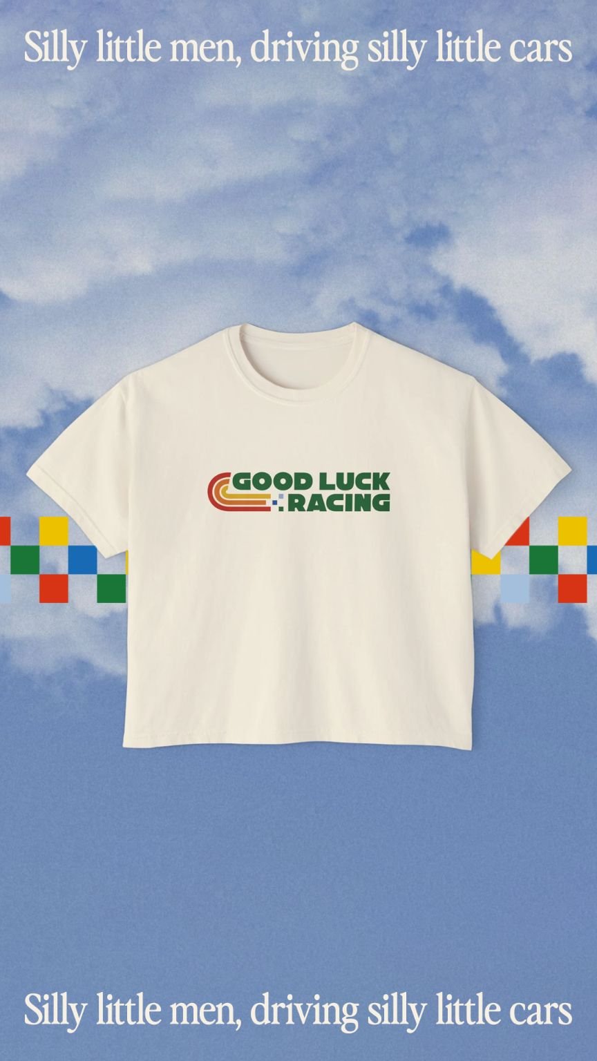 Cream tshirt  with "good luck racing" logo on it layered on a blue sky photo