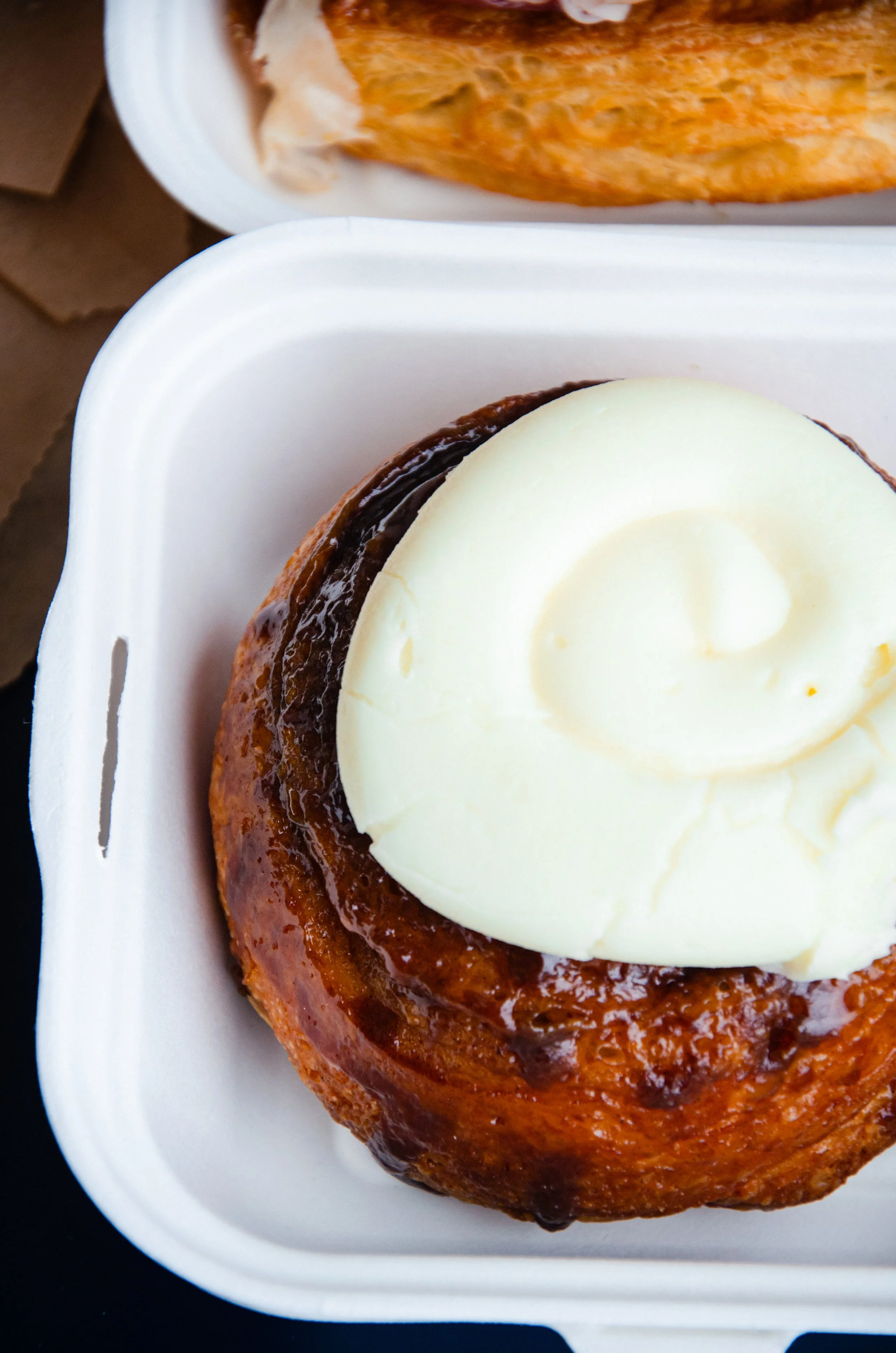 a delicious cinnamon roll with cream cheese frosting