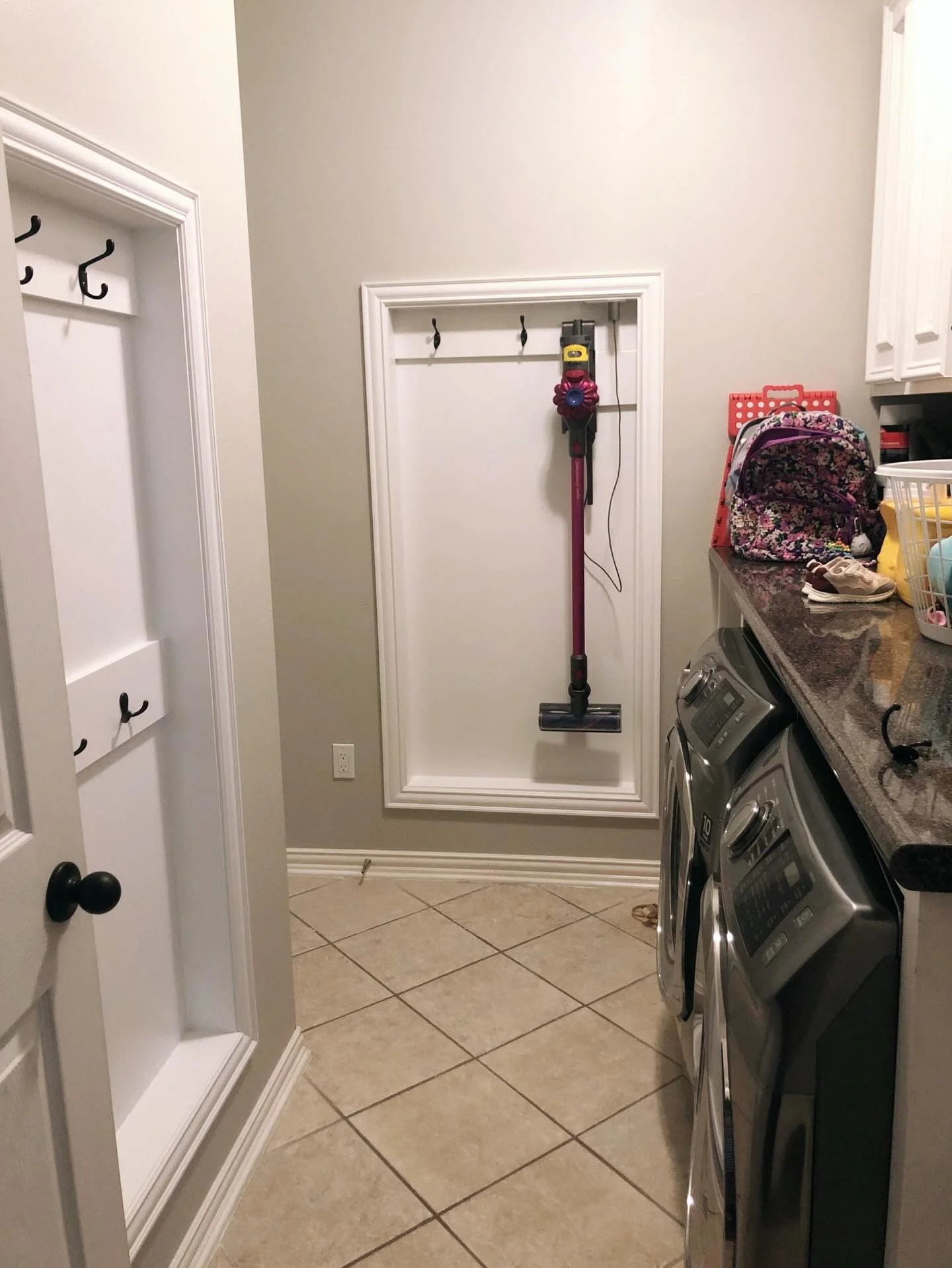 Small space, big impact. 🧺✨

In a narrow laundry room, every inch counts. We carved out these functional wall nooks to keep the vacuum and backpacks tucked away and off the floor. 🧹🎒

It&rsquo;s the ultimate hack for keeping a high-traffic area cl