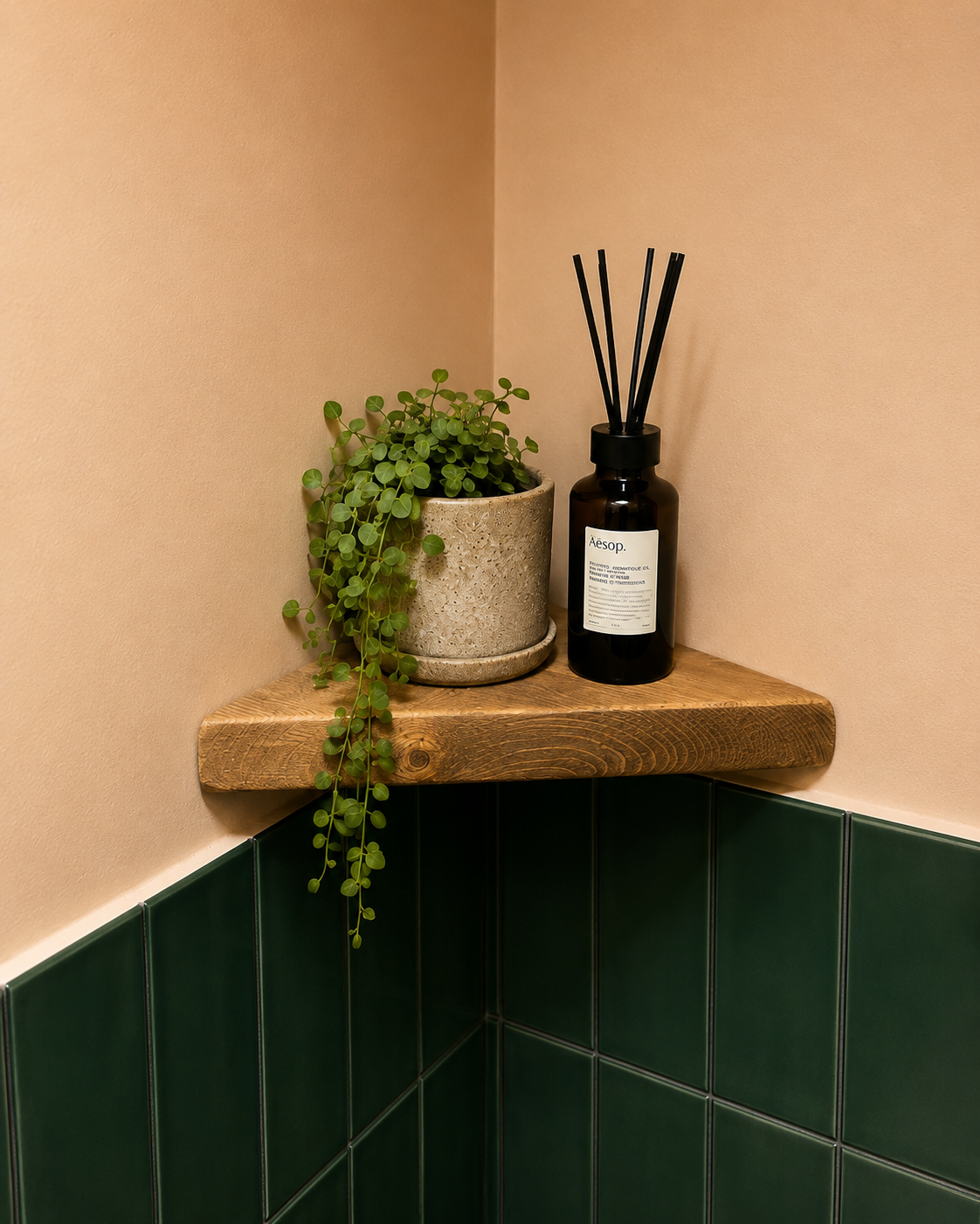 Reclaimed scaffold board corner shelf in a bathroom, made and finished in South London.