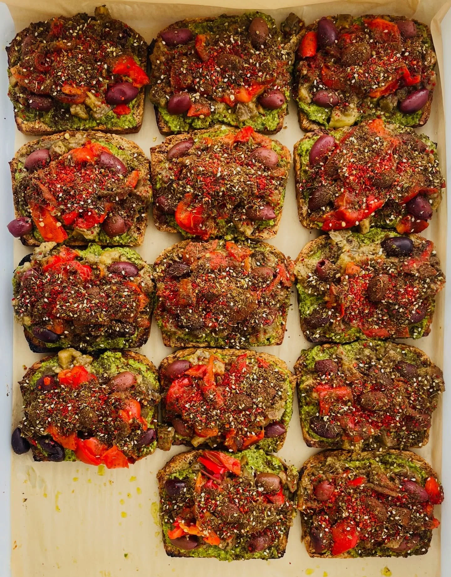 Somewhere between toast and a small ecosystem.

Nut-and-seed bread, walnut-kale pesto, roasted eggplant, peppers, olives, za&rsquo;atar, Aleppo pepper, sea salt.

Crunchy. Savory. Herbal. Just a little wild.

The kind of toast that tastes like it has