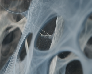 A closeup image of interlocking blue and gray fibers.
