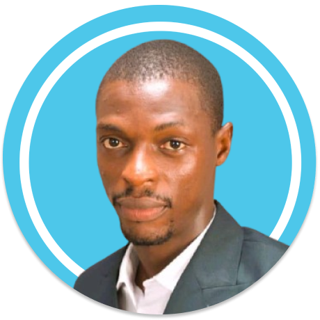 Headshot of a man with short hair, a beard, wearing a suit jacket and white shirt, against a blue background with circular design.