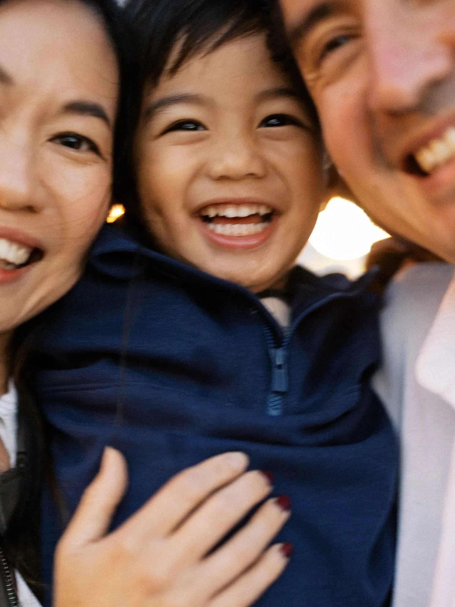 A blurry happy photo of a family in Melbourne