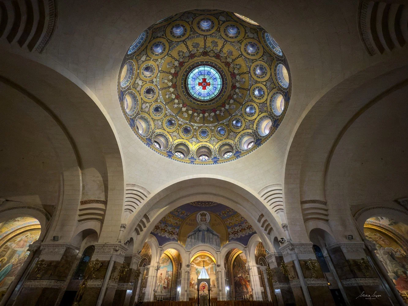 pilgrimage in the city of lourdes france dedicated to Lady Virgin Mary also known as Immaculate Conception who gave apparition to St. Bernadette featuring sanctuary church basilica grotto cave miraculous water and Marian procession