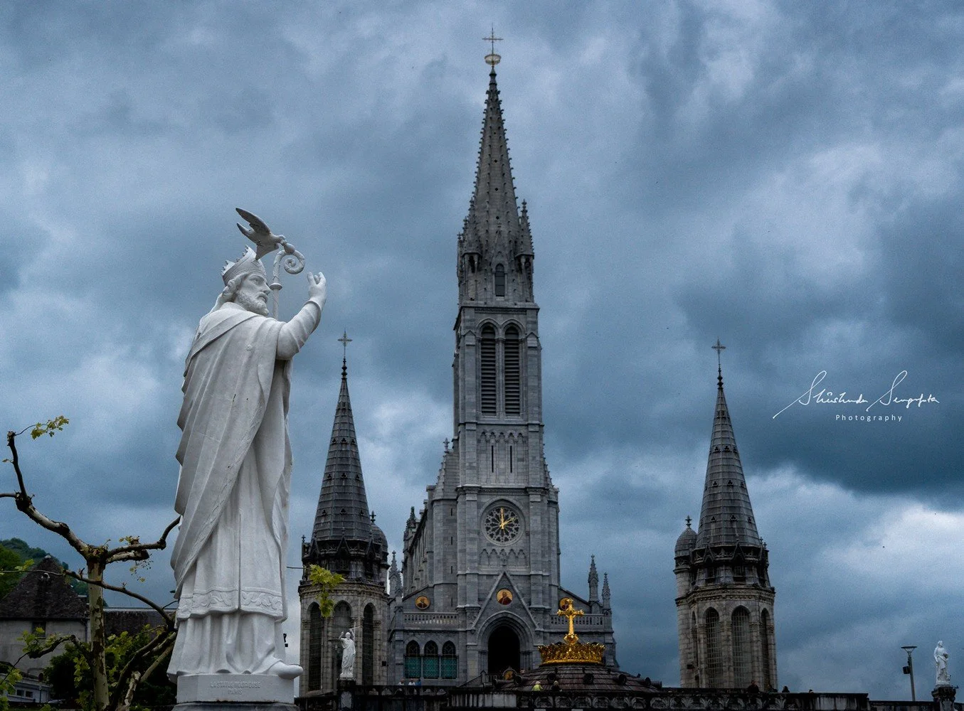 pilgrimage in the city of lourdes france dedicated to Lady Virgin Mary also known as Immaculate Conception who gave apparition to St. Bernadette featuring sanctuary church basilica grotto cave miraculous water and Marian procession