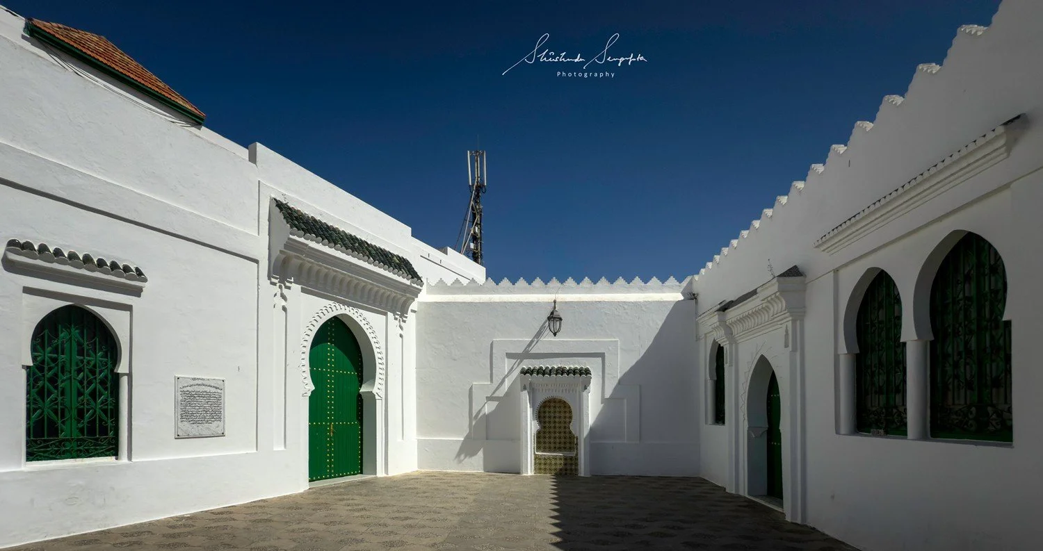 asilah in morocco africa featuring blue medina with painted doors windows street art graffiti mural krikia viewpoint raissouni palace alqamra tower and Grand Mosque