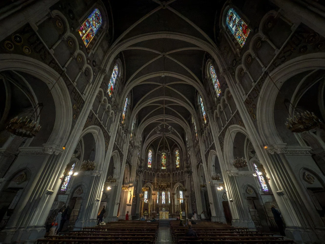 pilgrimage in the city of lourdes france dedicated to Lady Virgin Mary also known as Immaculate Conception who gave apparition to St. Bernadette featuring sanctuary church basilica grotto cave miraculous water and Marian procession