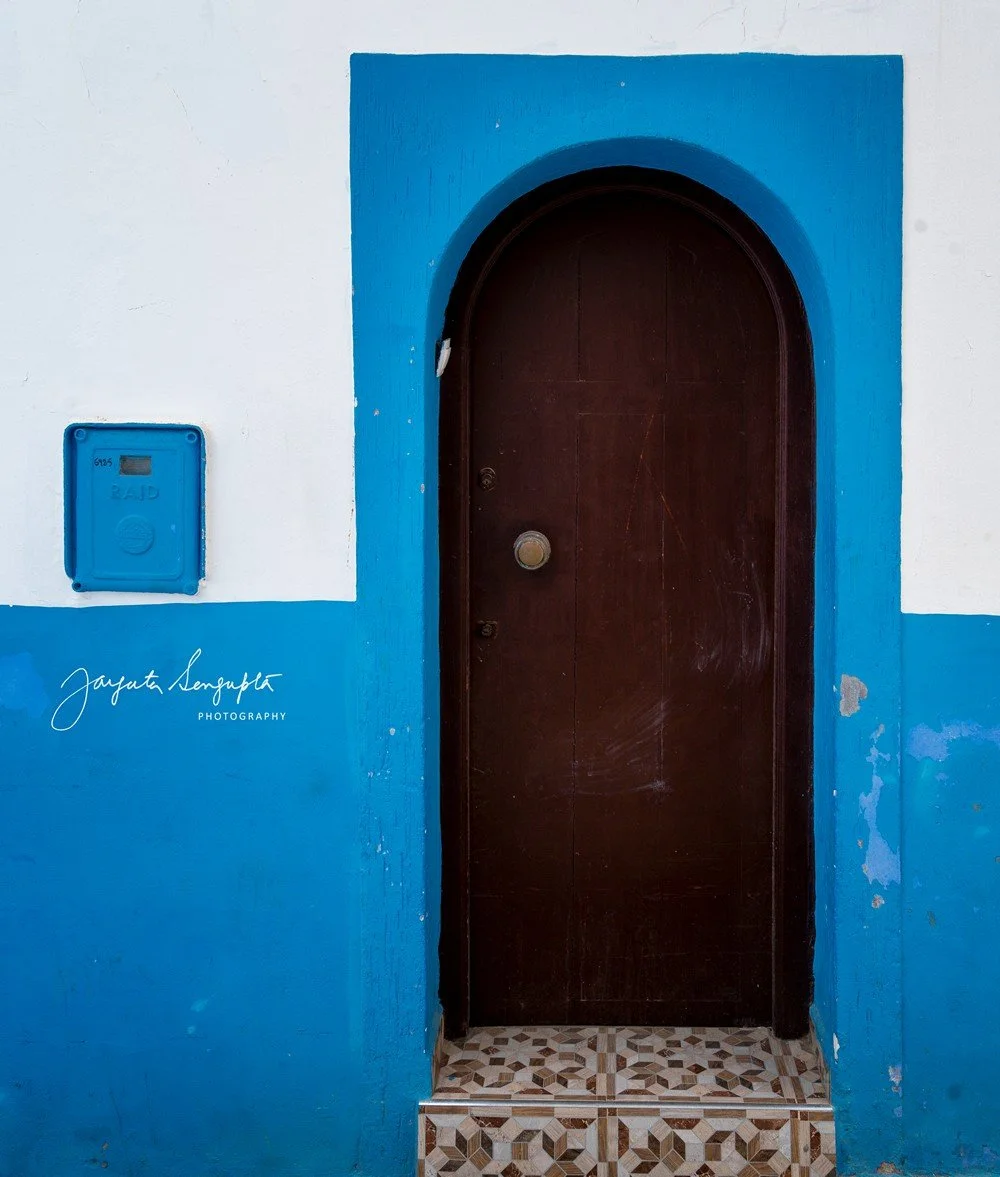asilah in morocco africa featuring blue medina with painted doors windows street art graffiti mural krikia viewpoint raissouni palace alqamra tower and Grand Mosque