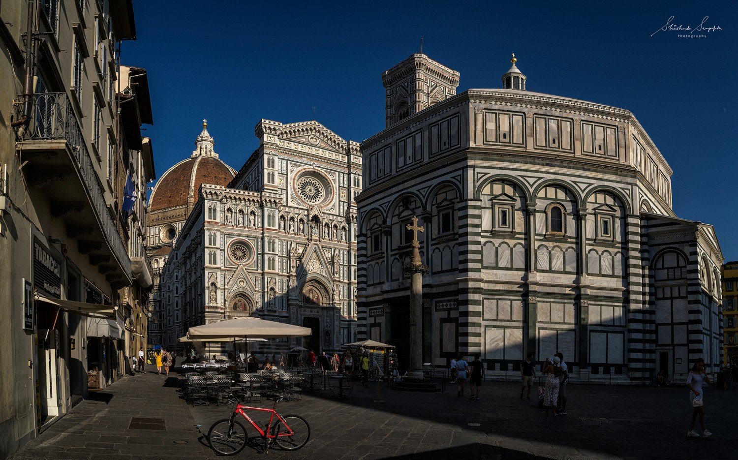 Battistero di San Giovanni Baptistry and Basilica di Santa Maria del Fiore Il Duomo di Firenze at Piazza del Duomo and Piazza di San Giovanni in florence tuscany italy shot during summer